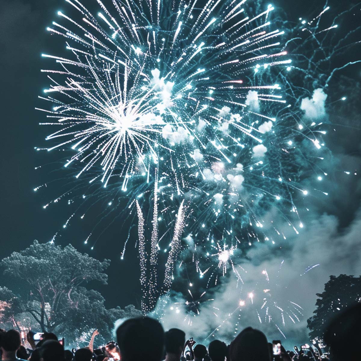 Fireworks over a lake at night with a full moon